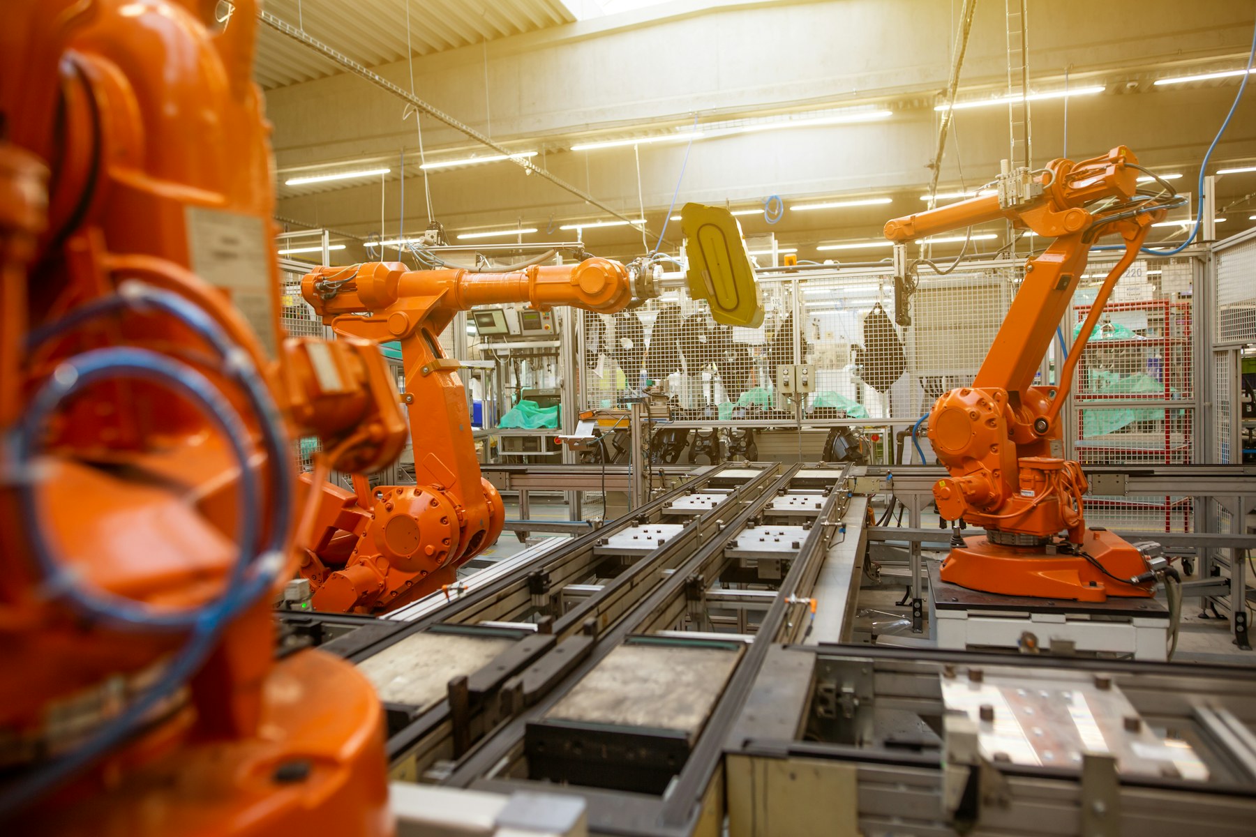 Workers and machinery on a manufacturing floor.