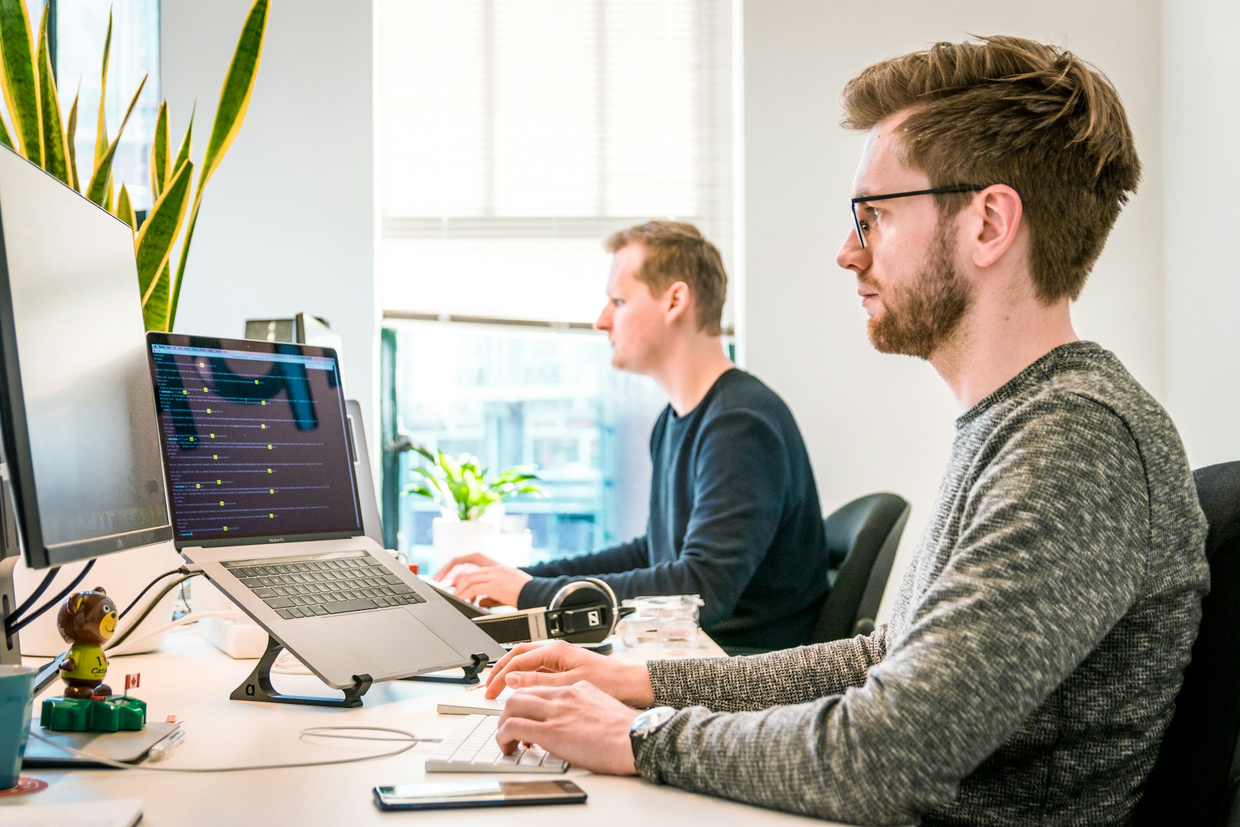 Professional services colleagues collaborating in a modern office.